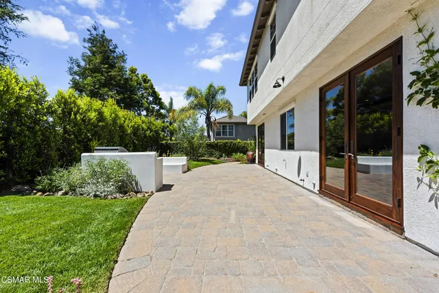 a view of a wooden door in a backyard