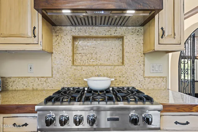 a kitchen with appliances and cabinets