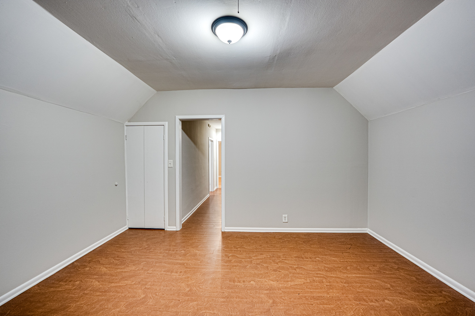 735 Sexton Street, Unit 2 Aurora, IL 60505 - Photo 13 of 18 an empty room with wooden floor and windows