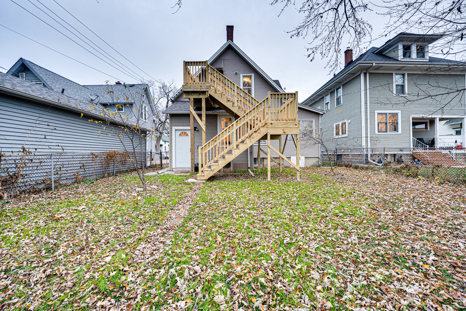 735 Sexton Street, Unit 2 Aurora, IL 60505 - Photo 14 of 18 a front view of a house with a yard