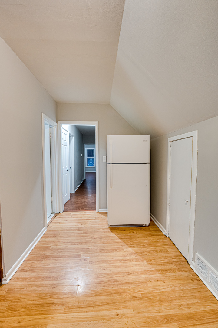 735 Sexton Street, Unit 2 Aurora, IL 60505 - Photo 6 of 18 a view of empty room with wooden floor