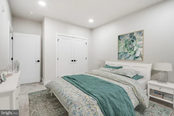 a bedroom with a bed and a couch