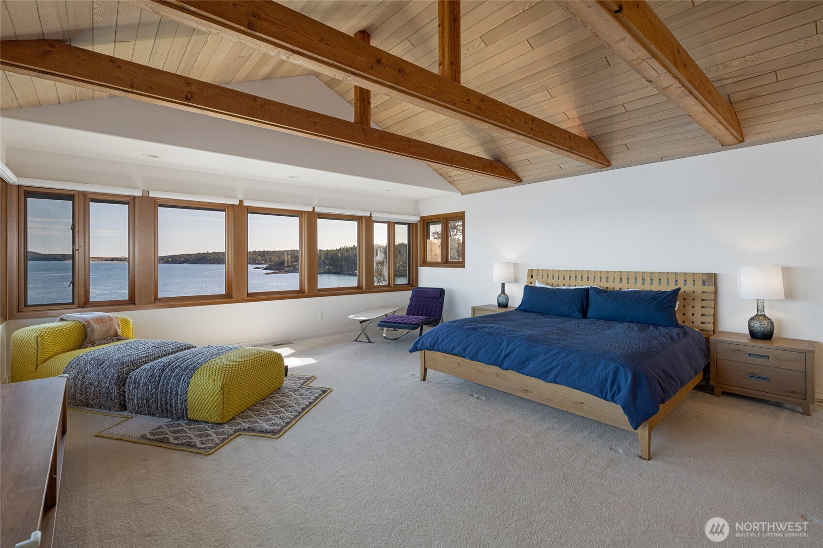 571 Golf Course Road Friday Harbor, WA 98250 - Photo 16 of 38 a spacious bedroom with a bed and a large window