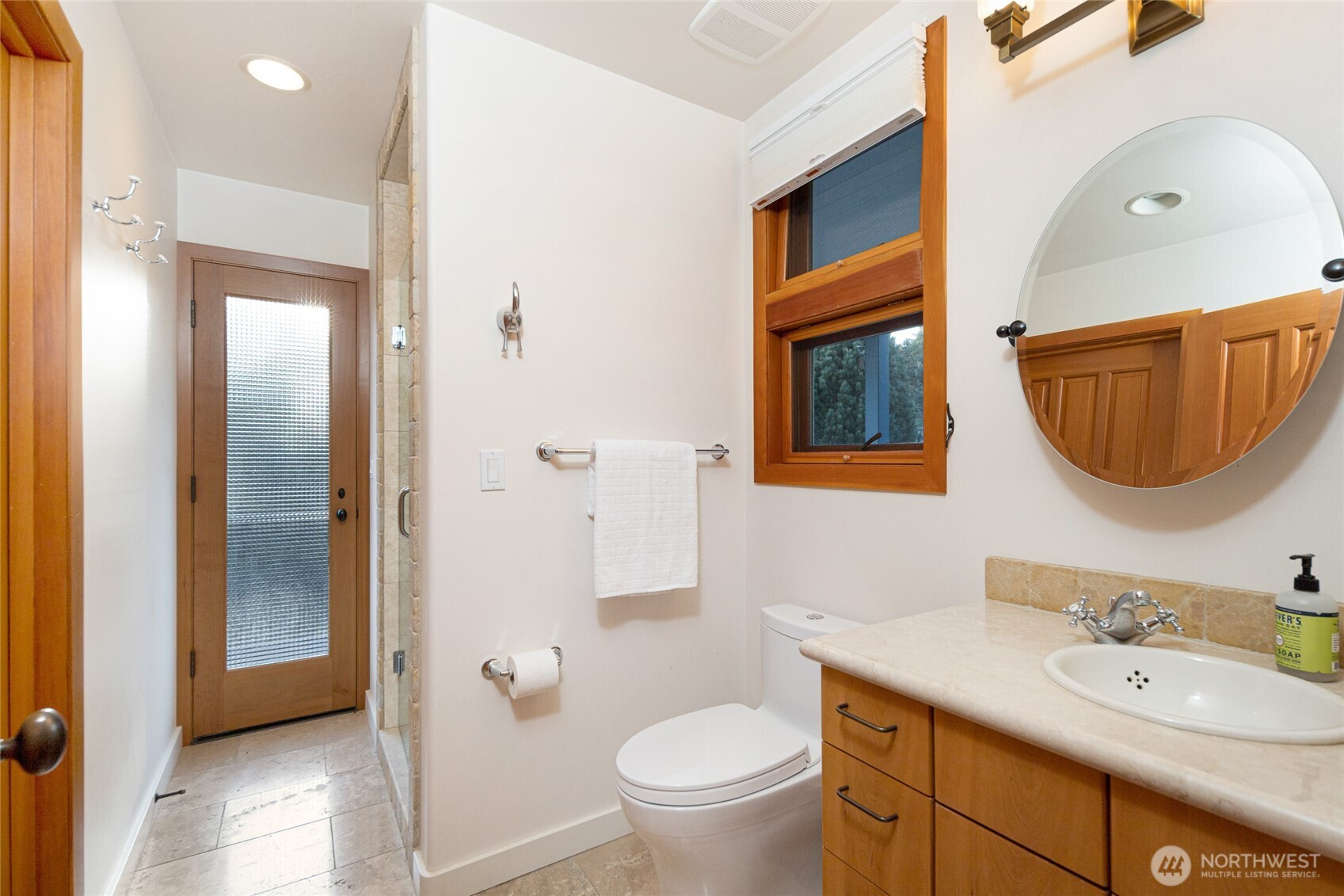 571 Golf Course Road Friday Harbor, WA 98250 - Photo 20 of 38 a bathroom with a granite countertop toilet a sink and a mirror