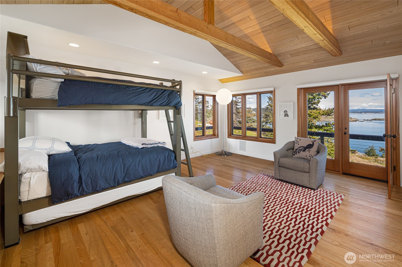 571 Golf Course Road Friday Harbor, WA 98250 - Photo 21 of 38 a living room with furniture and a wooden floor