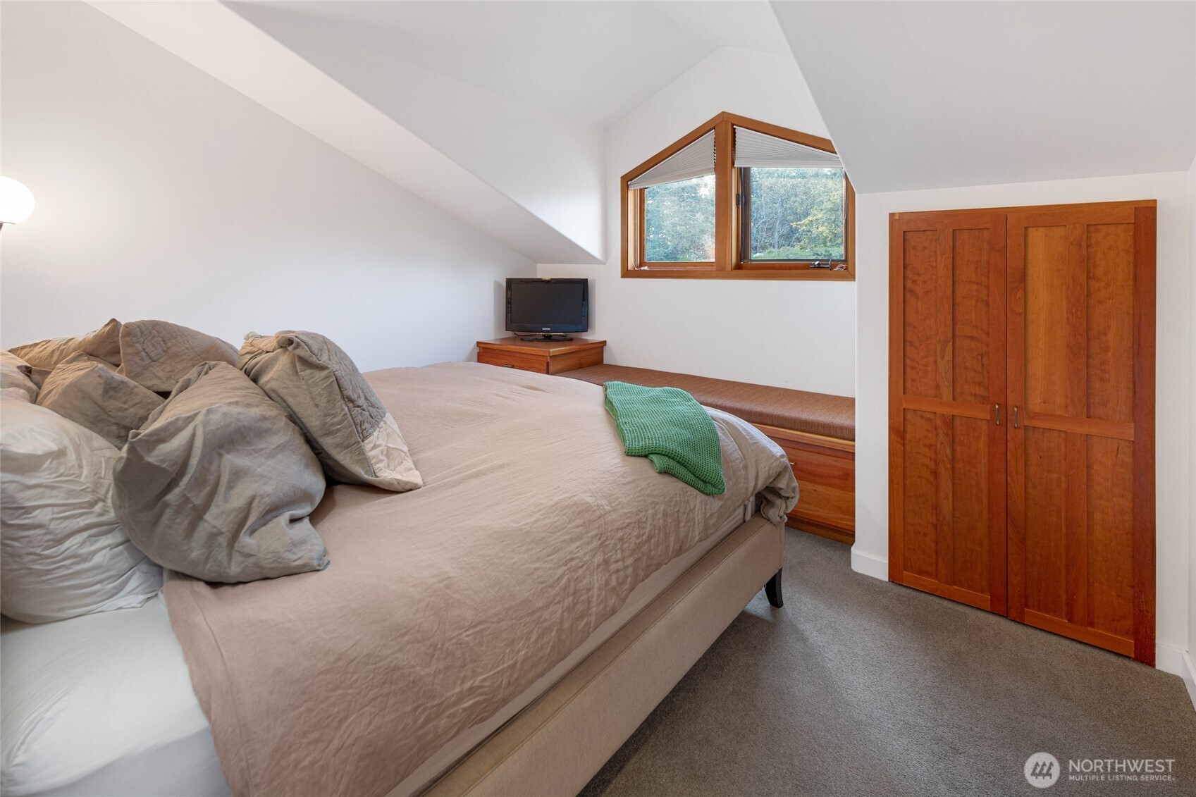 571 Golf Course Road Friday Harbor, WA 98250 - Photo 31 of 38 a bedroom with a bed and a window