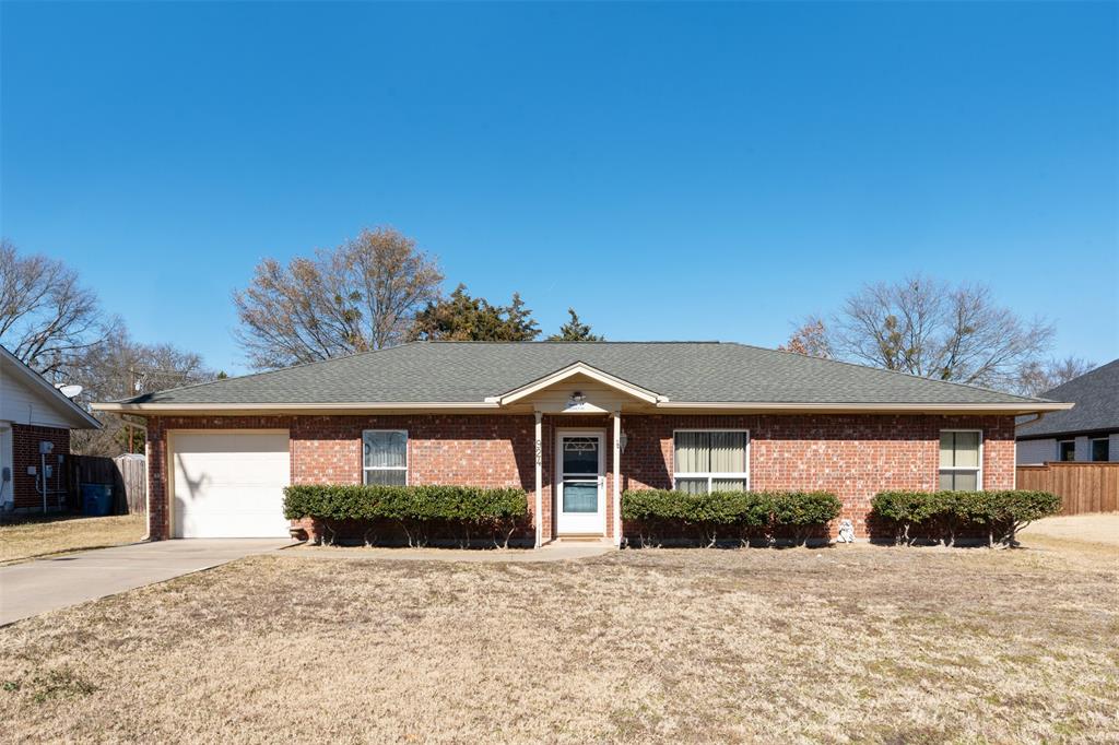 924 Guam Street Tool, TX 75143 - Photo 1 of 29 a front view of a house with a yard