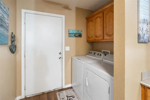 a utility room with dryer and washer
