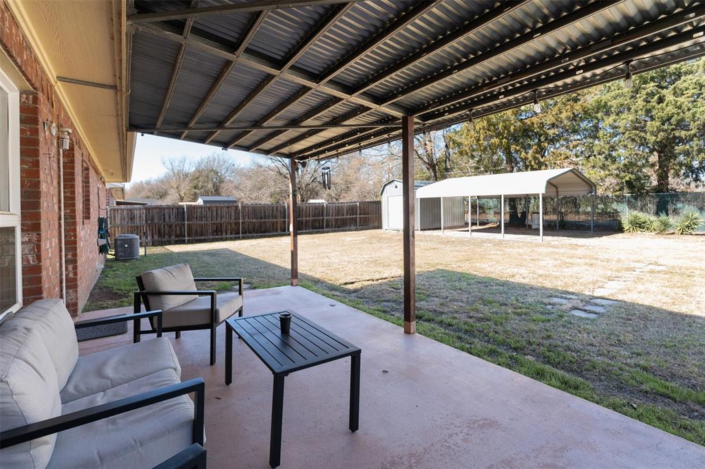 924 Guam Street Tool, TX 75143 - Photo 24 of 29 a view of a patio with a backyard