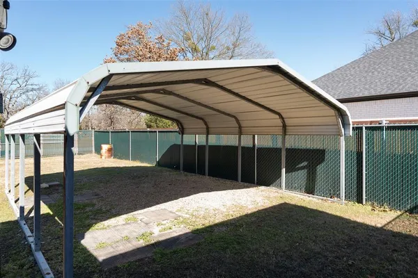 a view of backyard with cabin