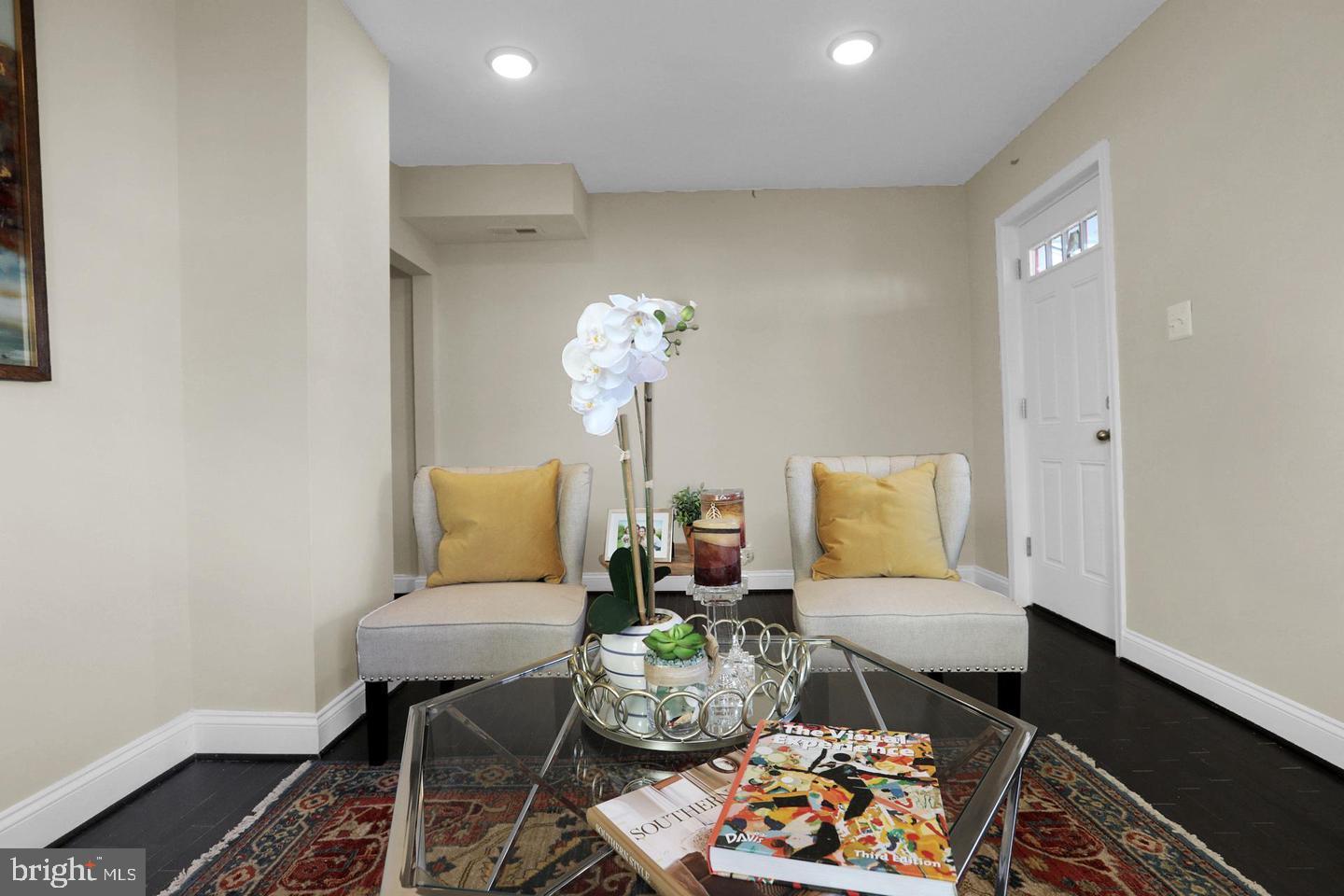 203 Sollers Point Road Dundalk, MD 21222 - Photo 2 of 14 a living room with furniture flowerpot and wooden floor
