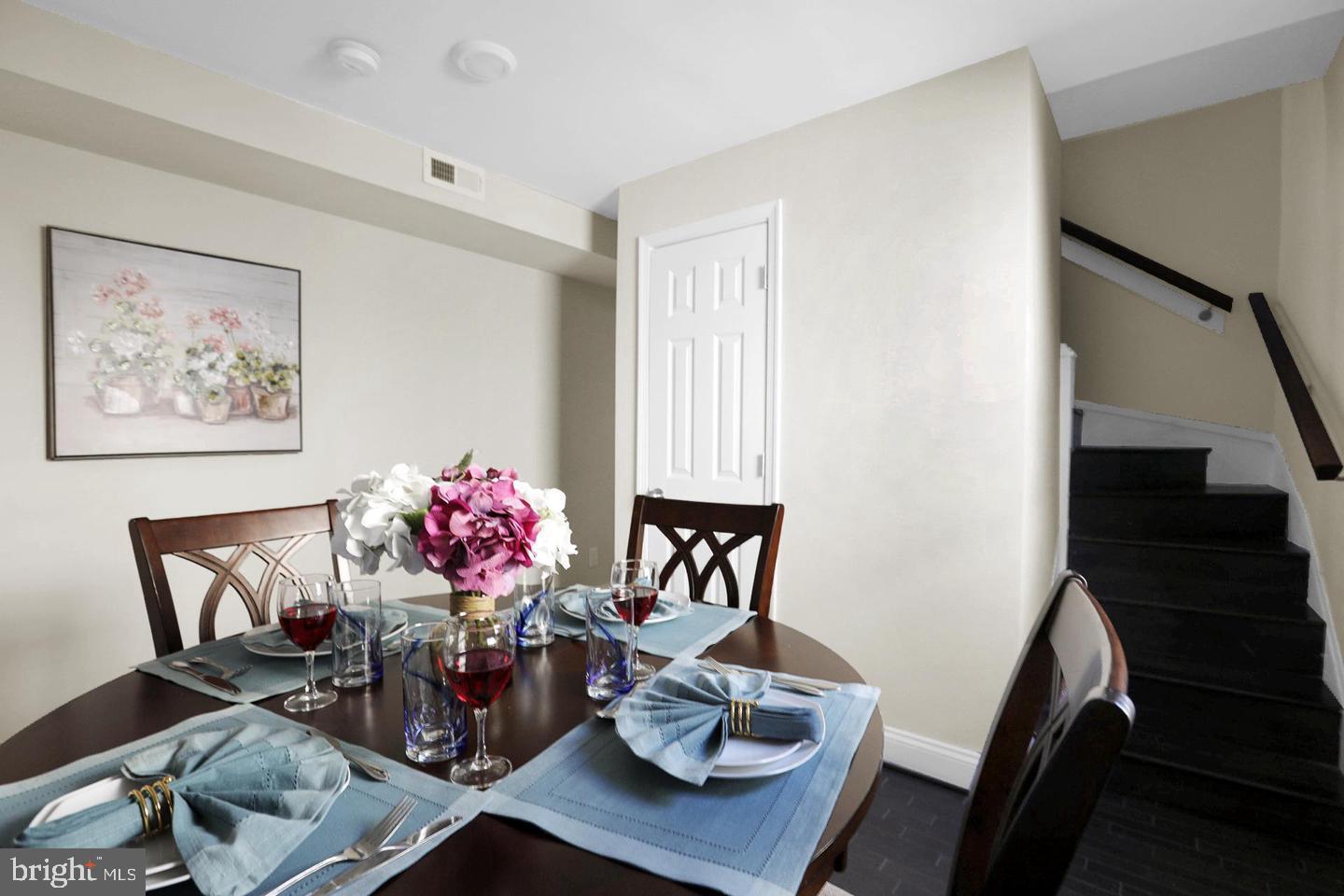 203 Sollers Point Road Dundalk, MD 21222 - Photo 4 of 14 a dining room with furniture and wooden floor