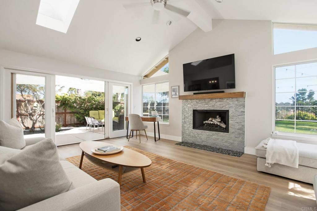 1708 Countryside Drive Vista, CA 92081 - Photo 1 of 1 a living room with furniture a flat screen tv and a fireplace
