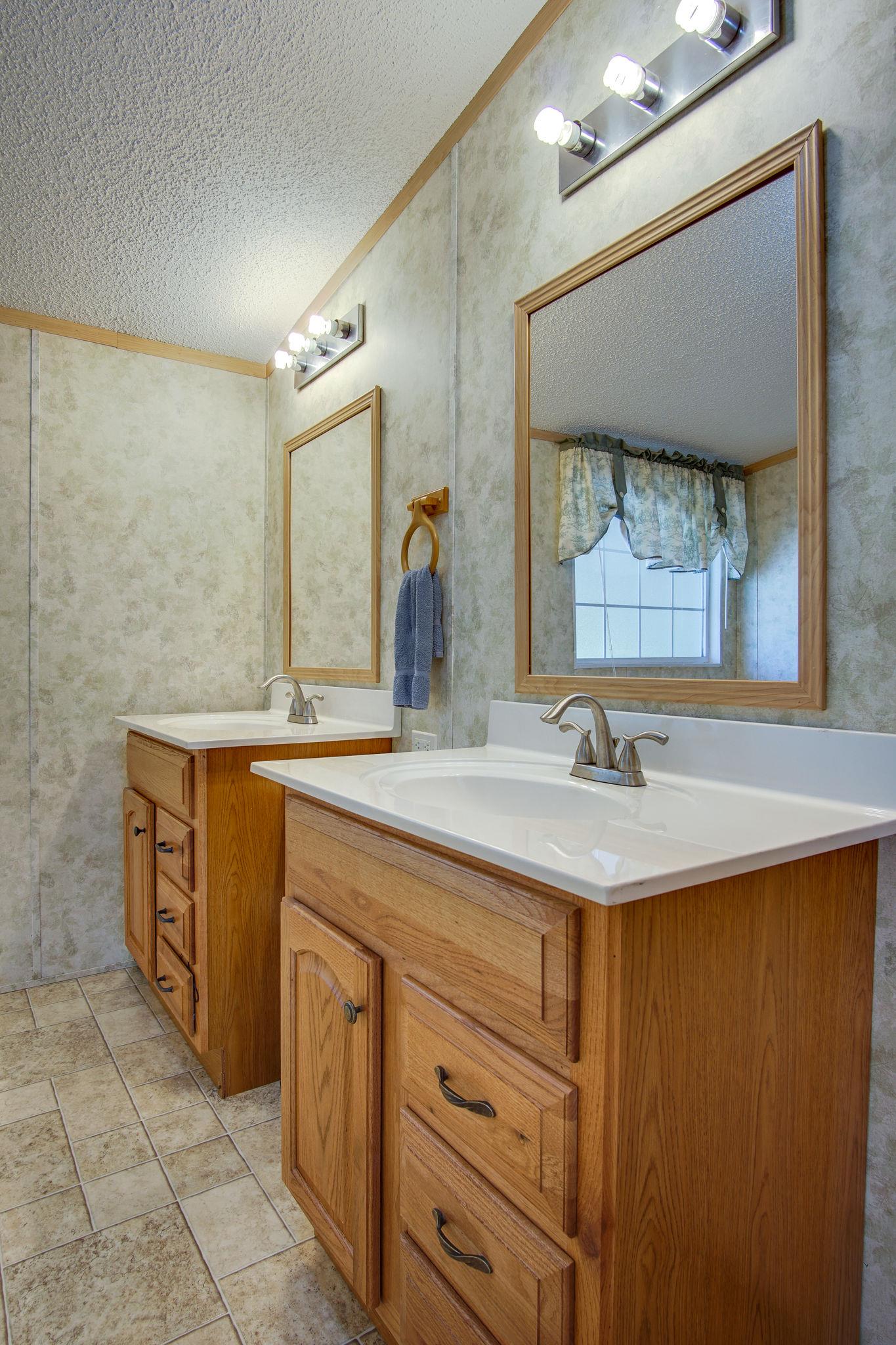 5318 Tobe Robertson Road Columbia, TN 38401 - Photo 20 of 26 There is plenty of space for two with these separate vanities in the master bathroom!
