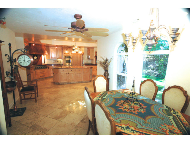 250 Lindenbrook Road Woodside, CA 94062 - Photo 4 of 13 a dining room with furniture and chandelier