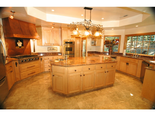 250 Lindenbrook Road Woodside, CA 94062 - Photo 5 of 13 a kitchen with stainless steel appliances granite countertop a sink and cabinets