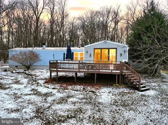 a house view with a sitting space and garden