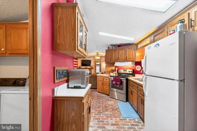 a kitchen with lots of counter top space and appliances