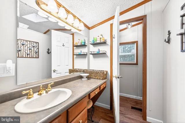 a dining room with furniture water view and a large window