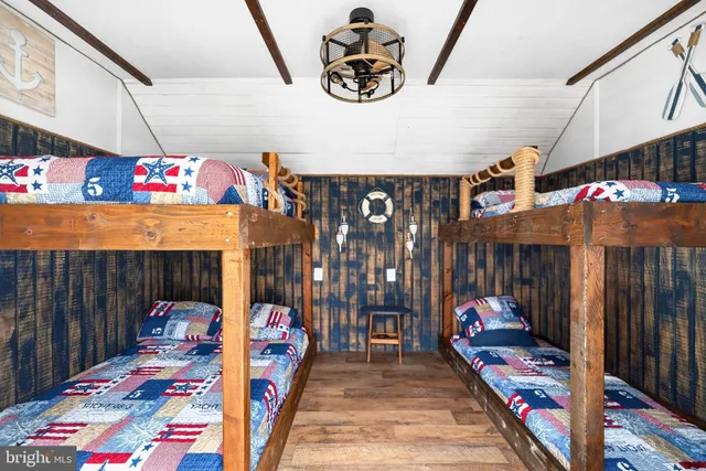 a view of a lounge chairs in a backyard