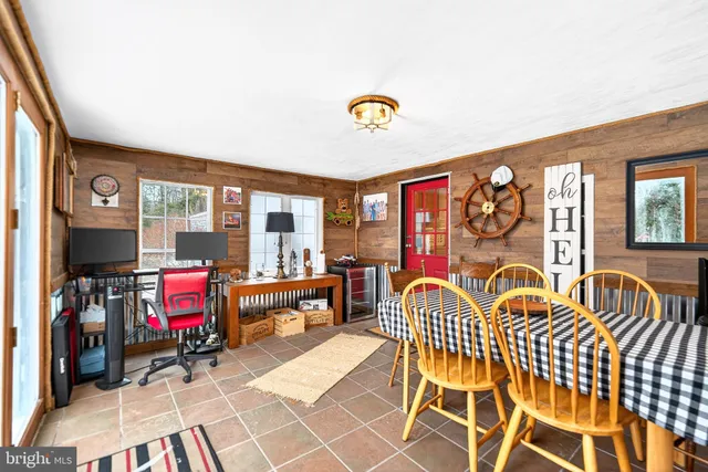 a view of a house with a yard and sitting area