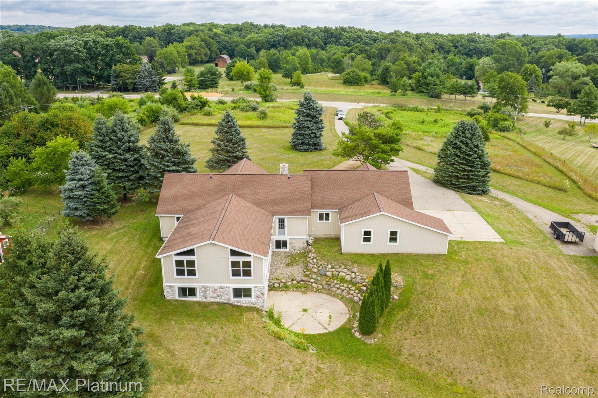 593 North Hacker Road Howell, MI 48843 - Photo 42 of 48 Check out the pretty pine trees!