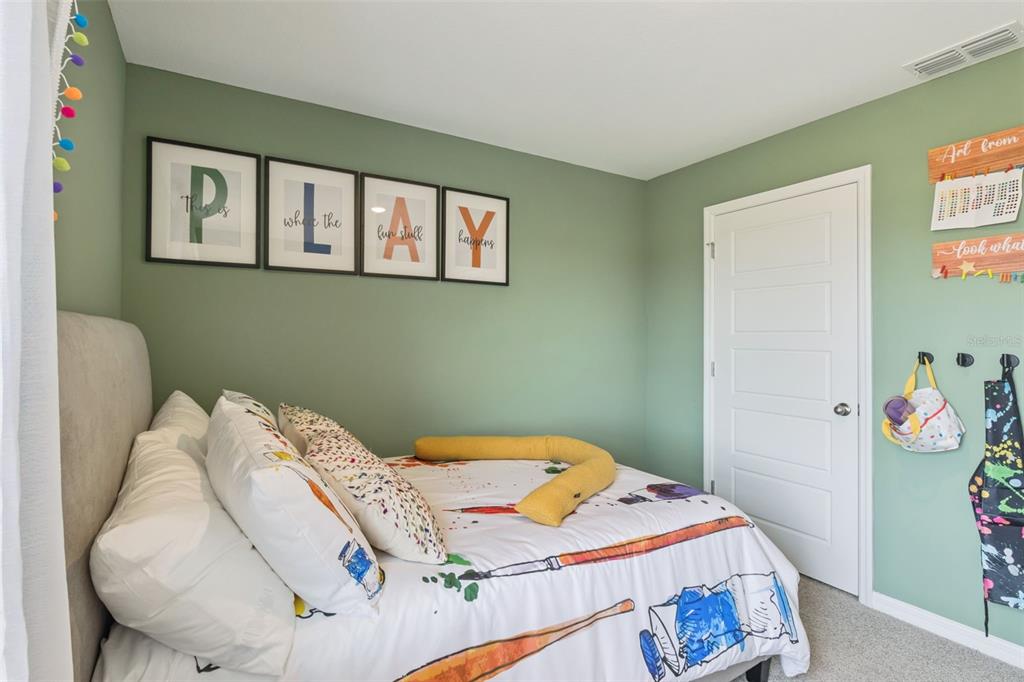 3437 Nettle Loop Tavares, FL 32778 - Photo 28 of 31 a bedroom with a bed and a window