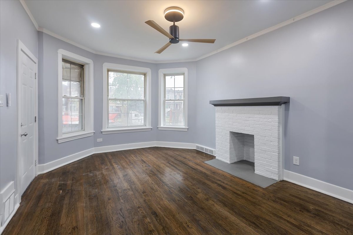 4626 West Monroe Street Chicago, IL 60644 - Photo 11 of 34 a view of an empty room with wooden floor and a window