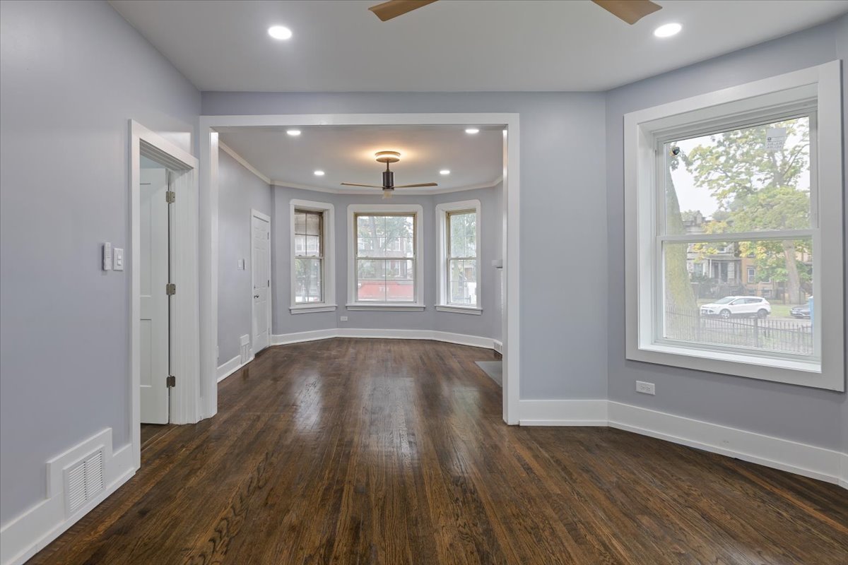 4626 West Monroe Street Chicago, IL 60644 - Photo 10 of 34 a view of an empty room with wooden floor and a window