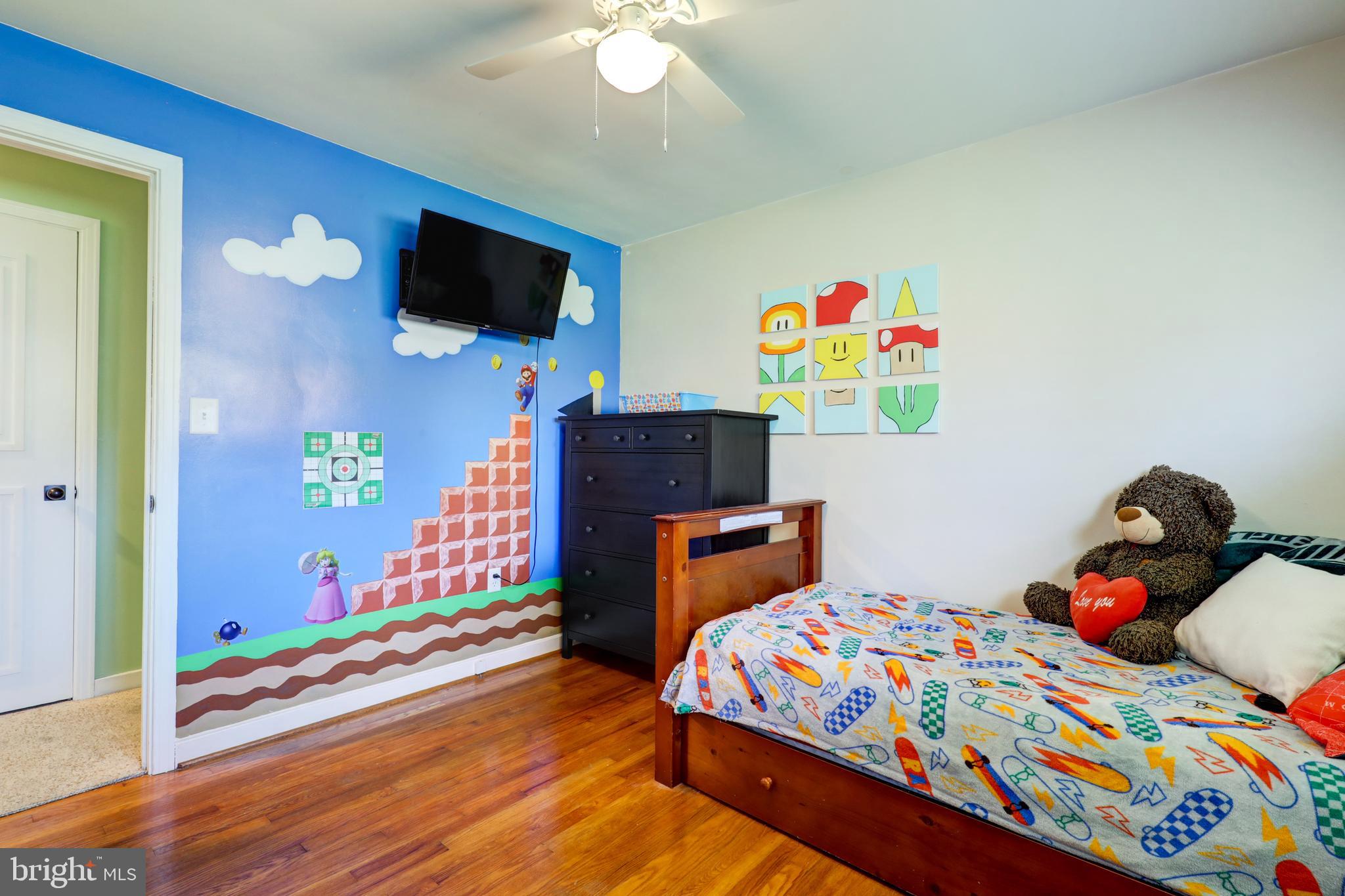210 South 8th Street Akron, PA 17501 - Photo 15 of 31 a bedroom with a bed and wooden floor