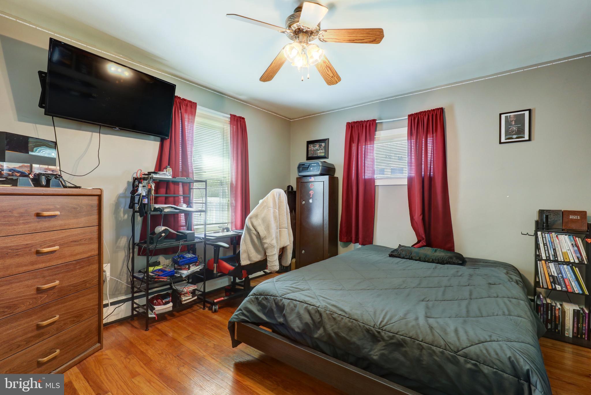 210 South 8th Street Akron, PA 17501 - Photo 16 of 31 a bedroom with a bed and a flat screen tv