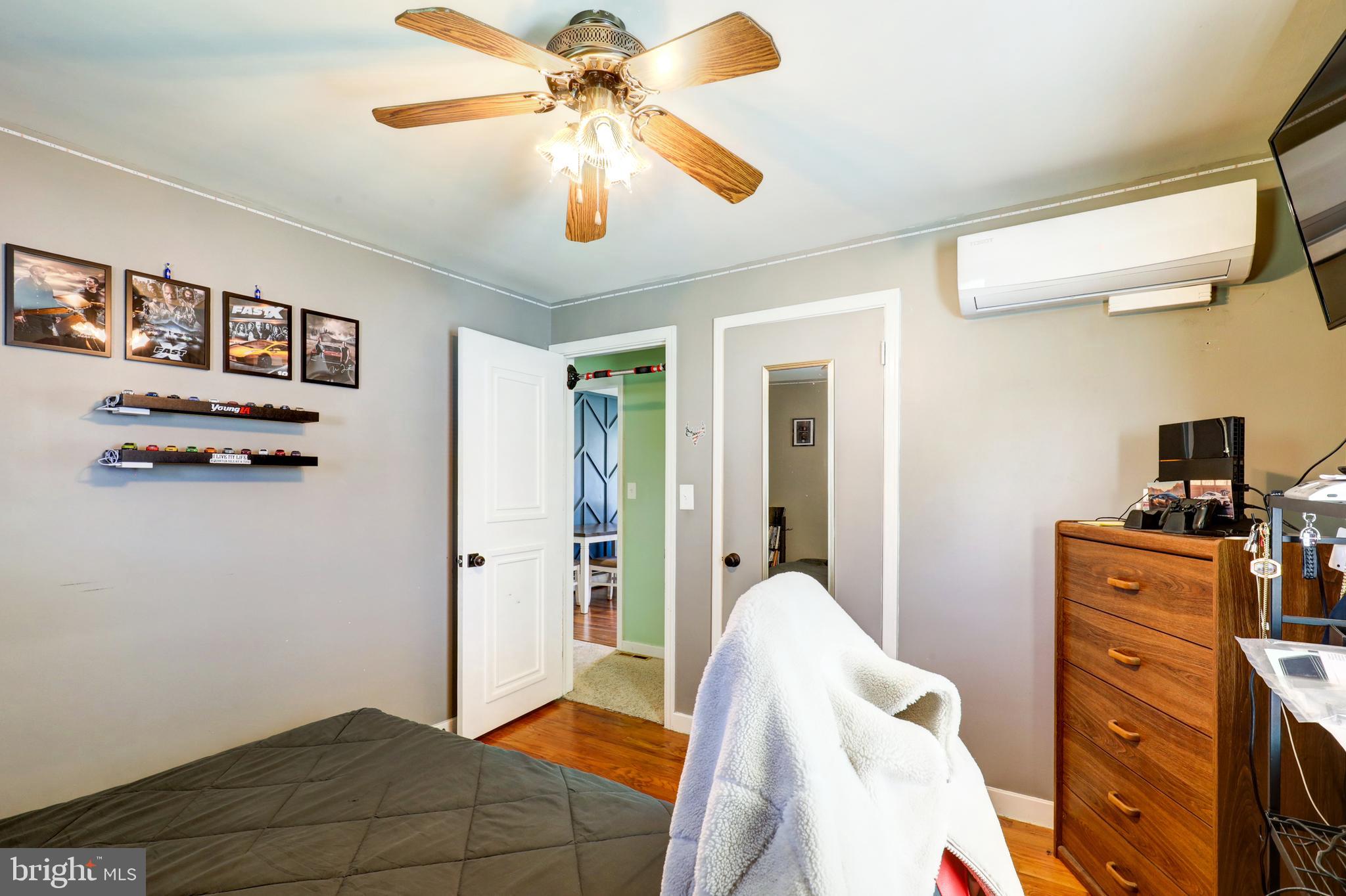 210 South 8th Street Akron, PA 17501 - Photo 17 of 31 a bedroom with furniture and a chandelier fan