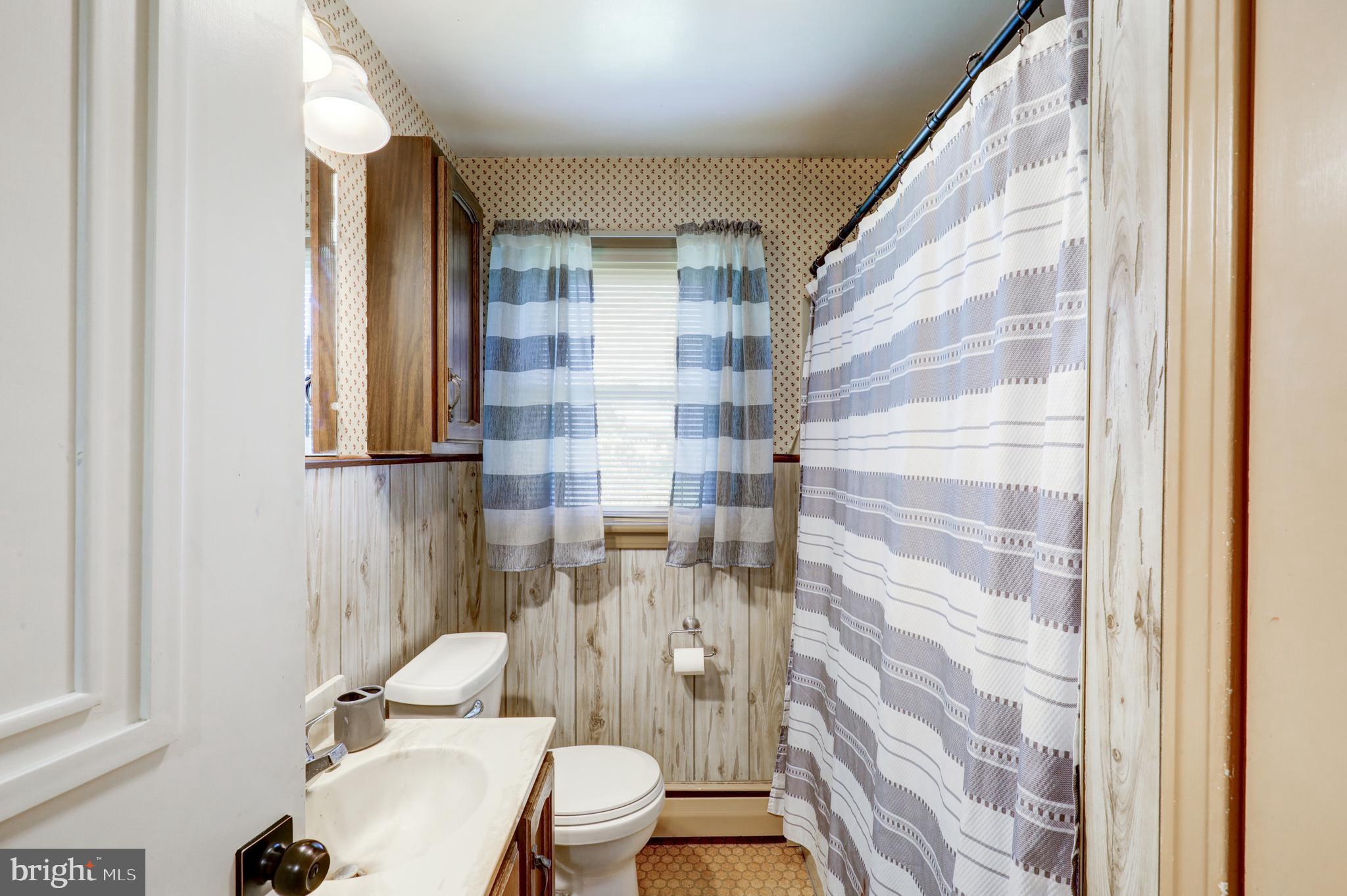 210 South 8th Street Akron, PA 17501 - Photo 18 of 31 a bathroom with a toilet and a shower