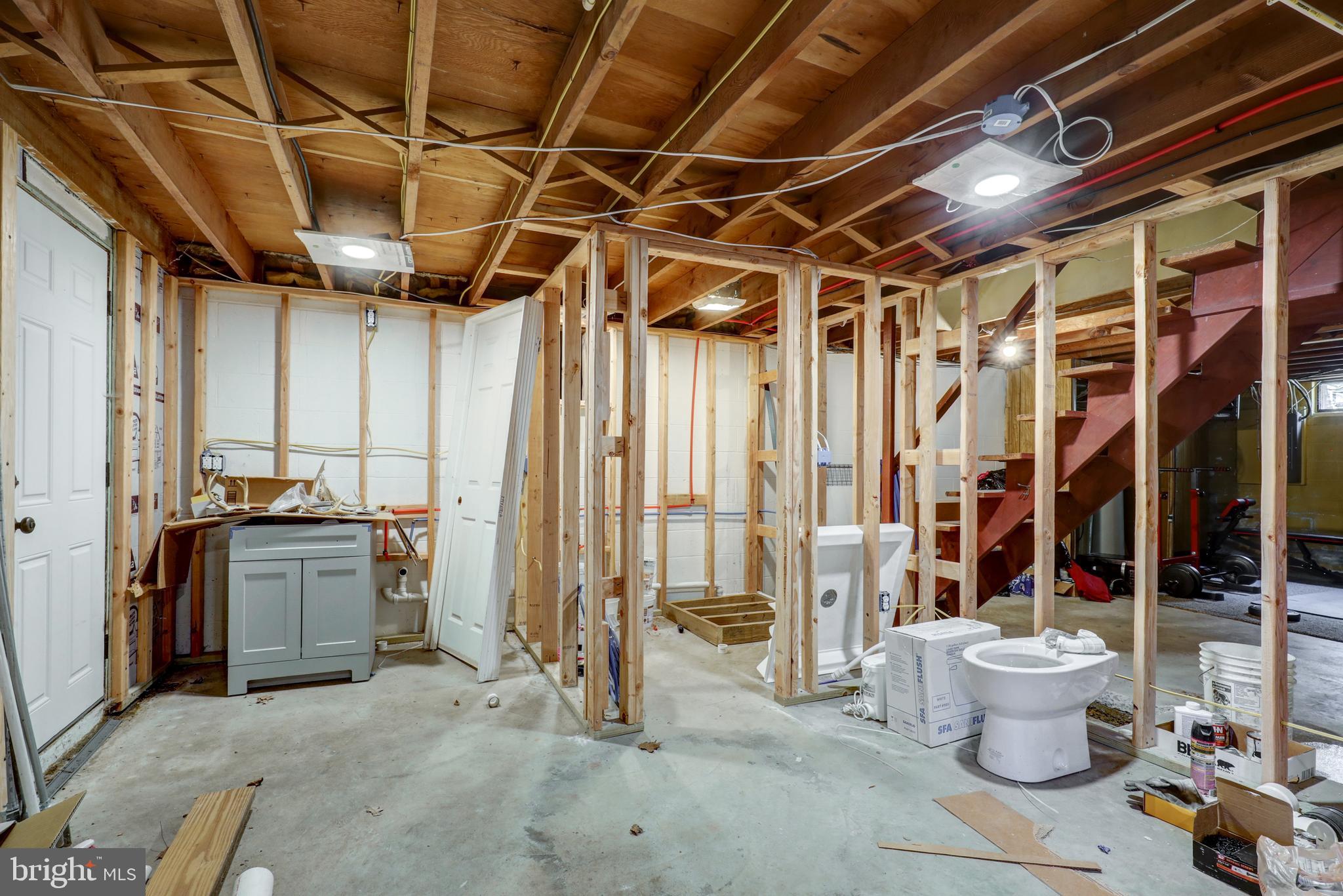 210 South 8th Street Akron, PA 17501 - Photo 22 of 31 a view of a storage room with water heater and racks