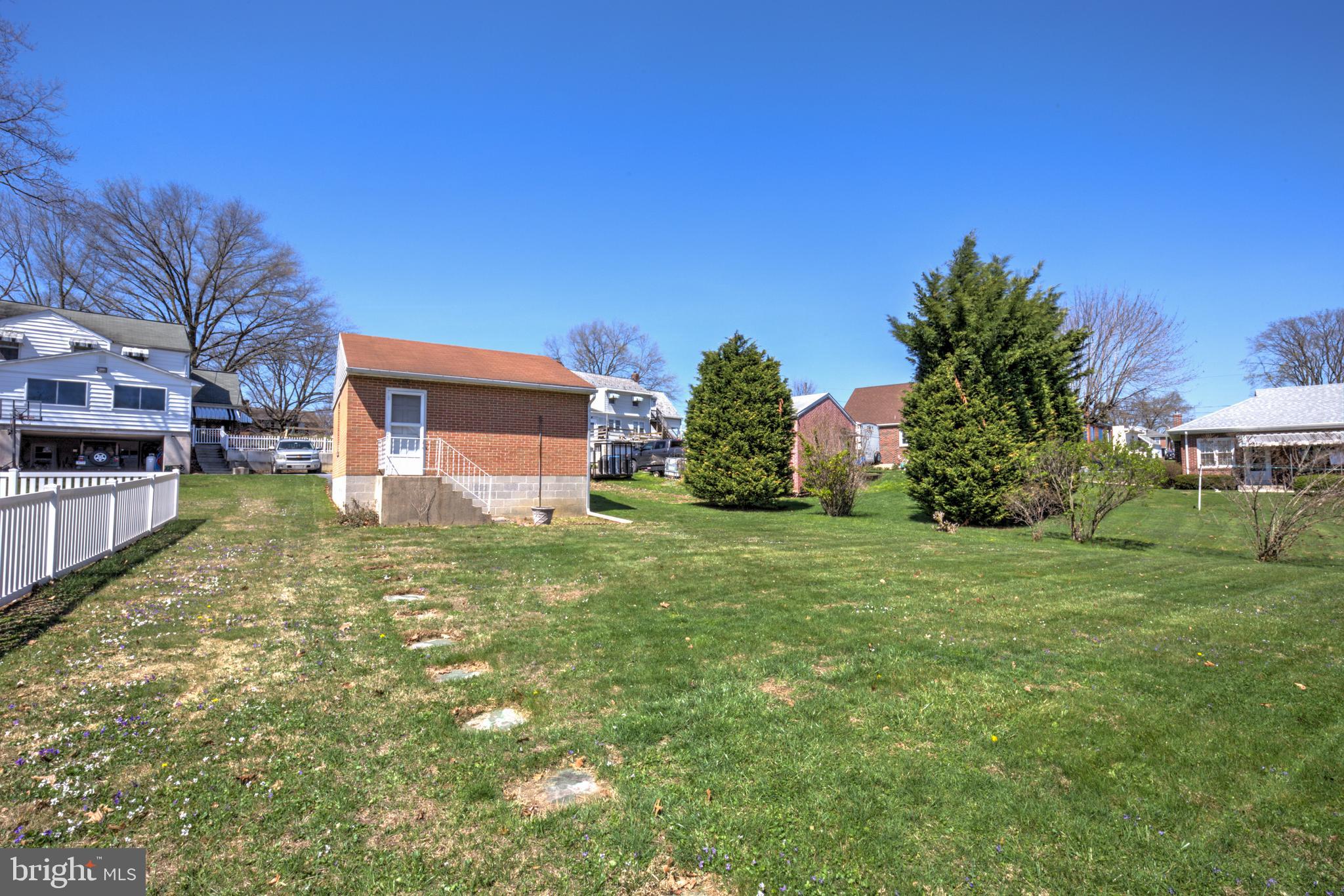 210 South 8th Street Akron, PA 17501 - Photo 25 of 31 a view of a backyard with plants and large trees