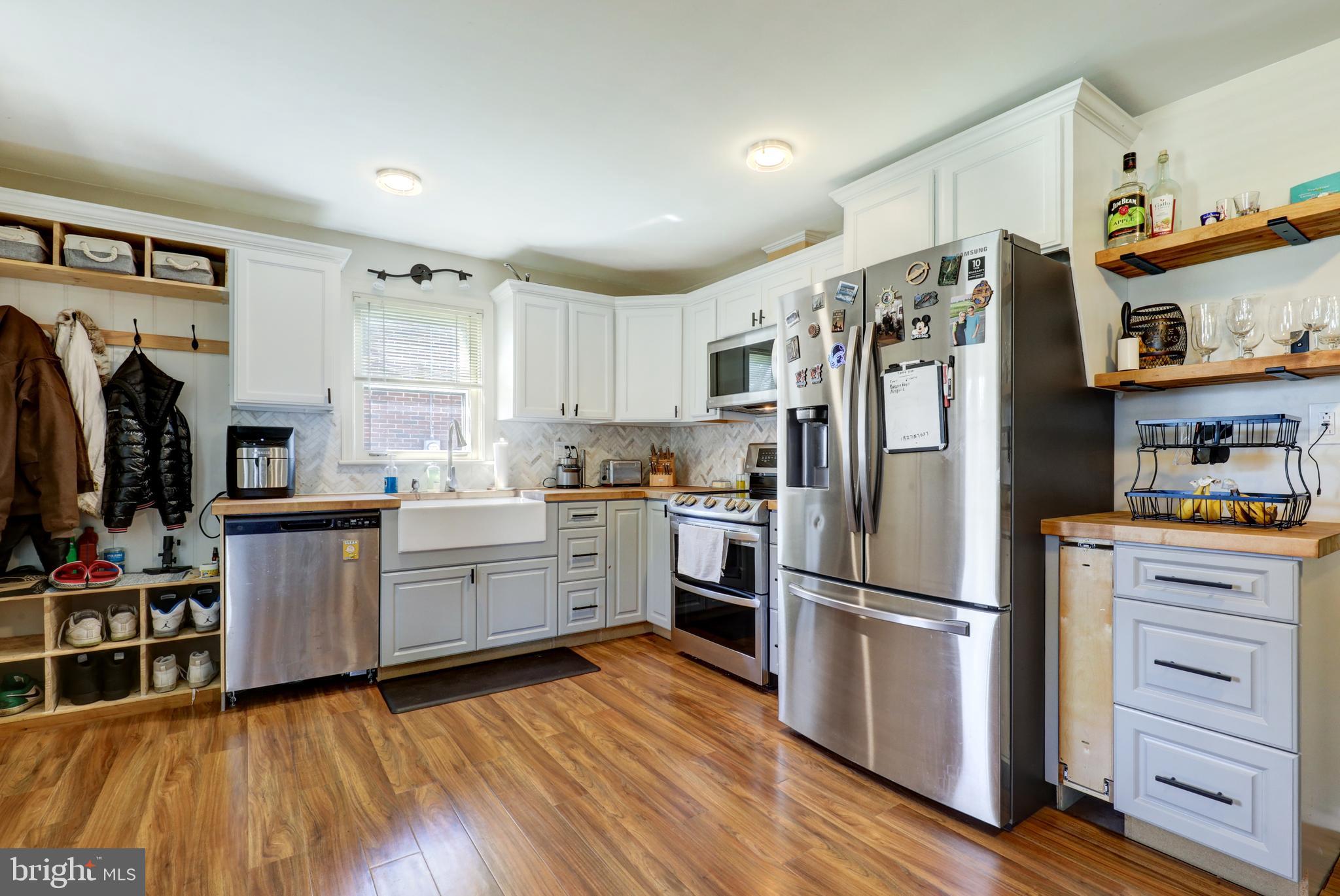 210 South 8th Street Akron, PA 17501 - Photo 8 of 31 a kitchen with a refrigerator and a stove top oven