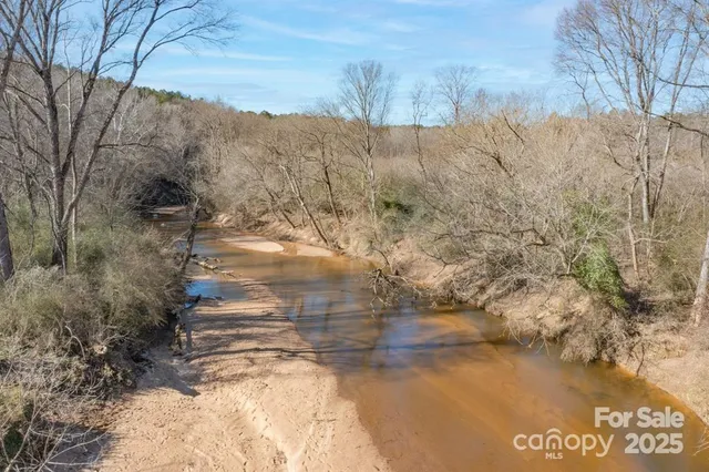 a view of a yard with an ocean