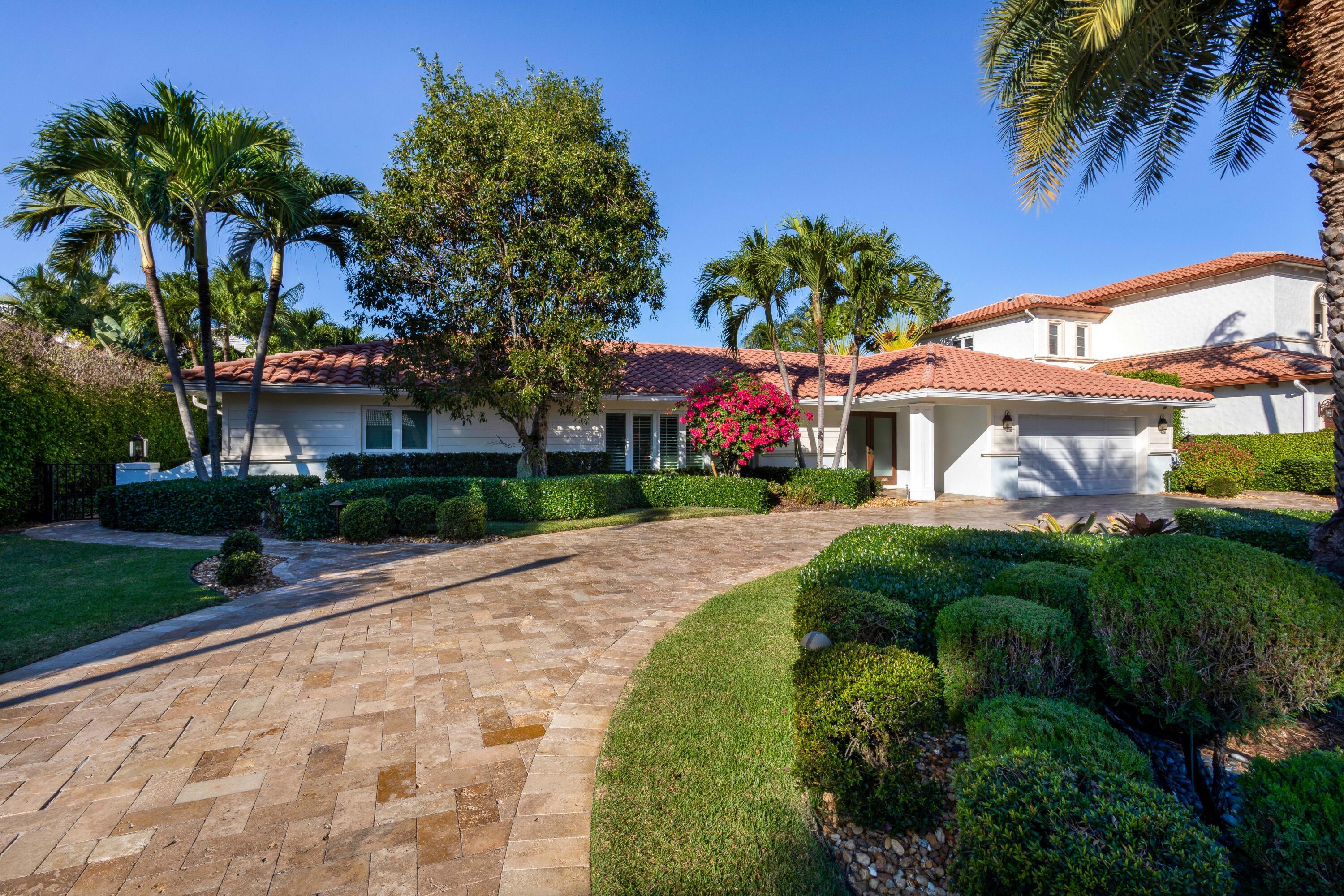 2255 Date Palm Road Boca Raton, FL 33432 - Photo 1 of 14 a front view of a house with a yard and garage