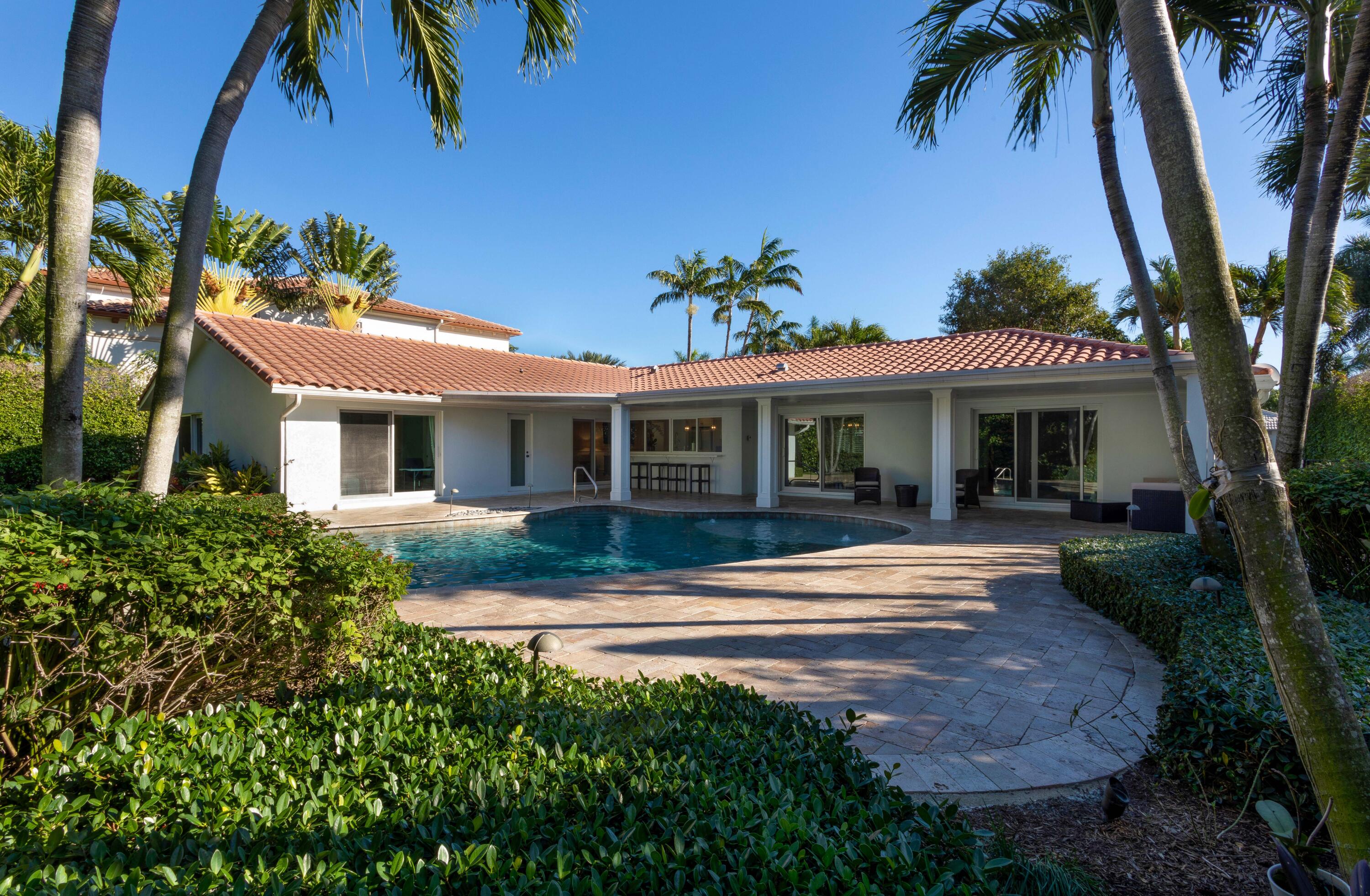 2255 Date Palm Road Boca Raton, FL 33432 - Photo 13 of 14 a front view of a house with a garden