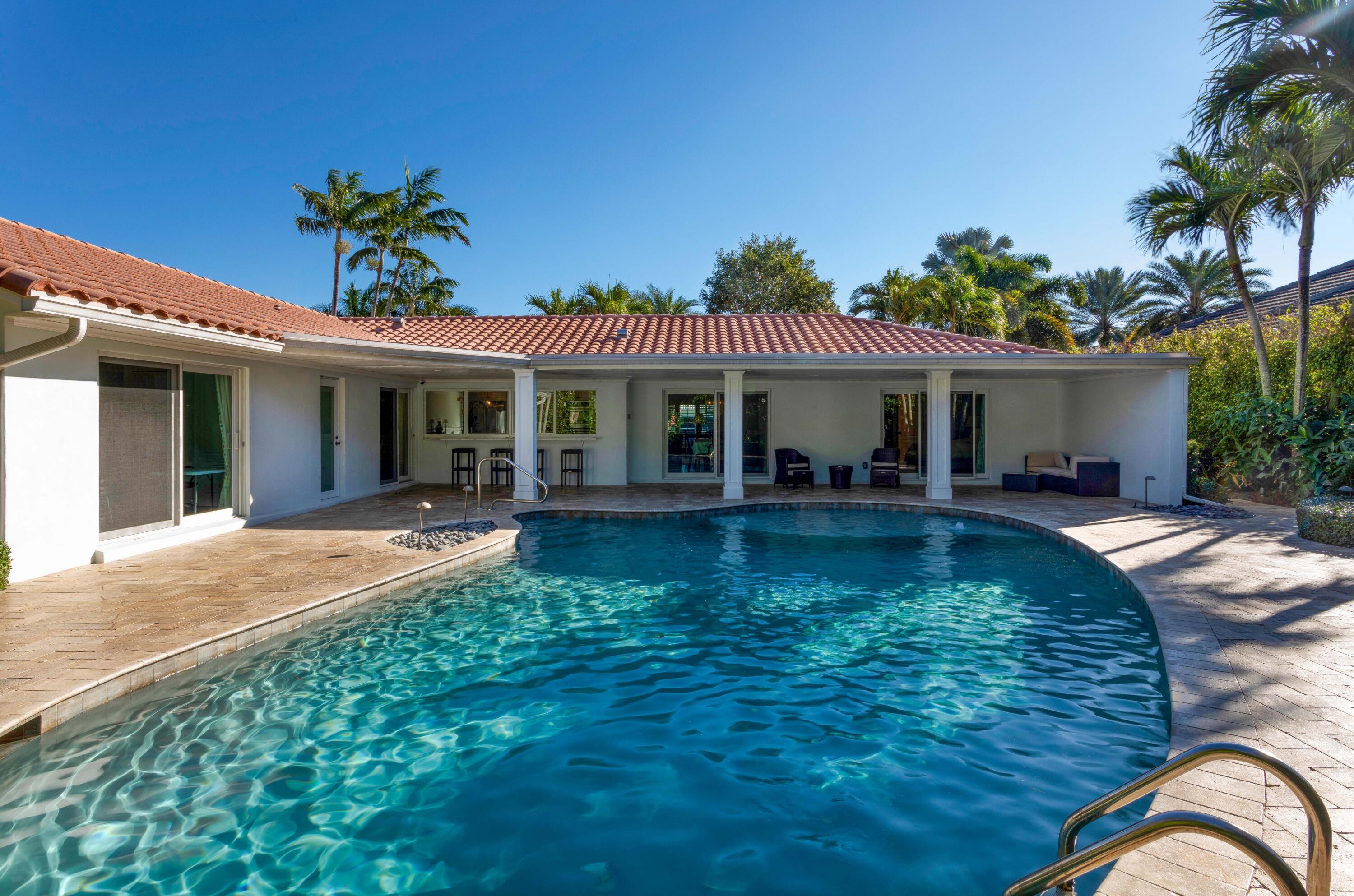 2255 Date Palm Road Boca Raton, FL 33432 - Photo 14 of 14 a view of a house with swimming pool and porch