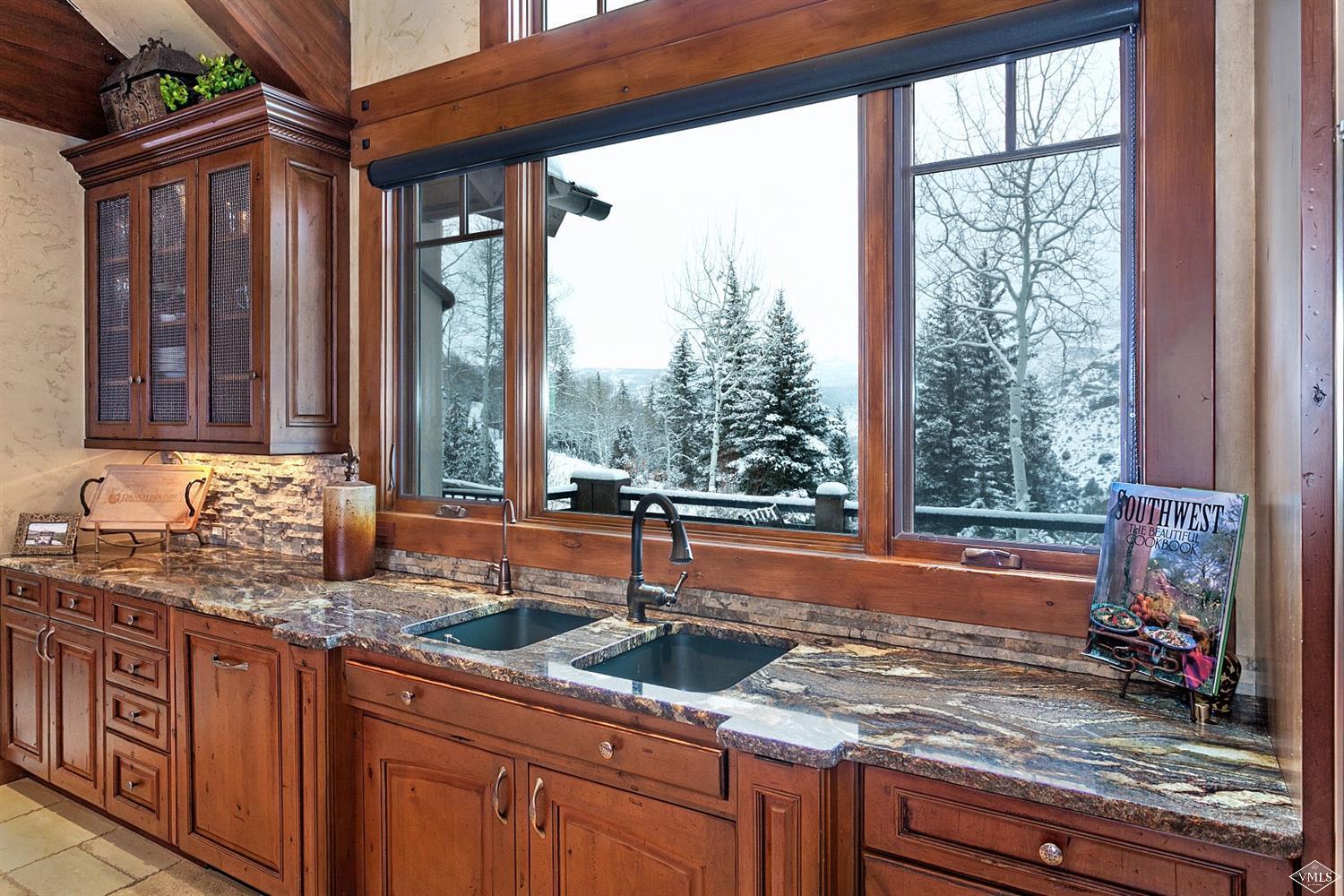 605 Andorra Road Edwards, CO 81632 - Photo 11 of 25 a kitchen with granite countertop a sink and a window