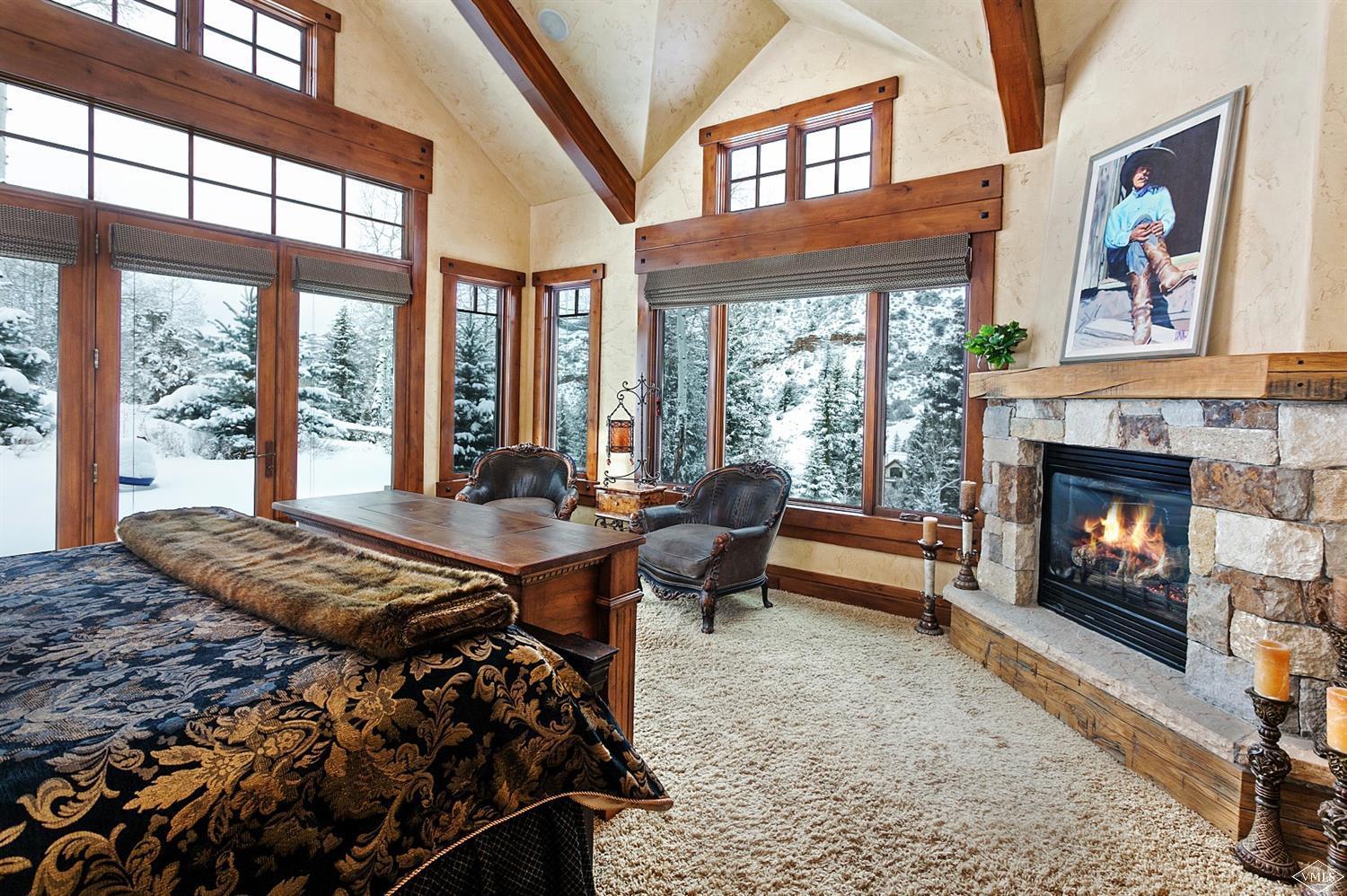 605 Andorra Road Edwards, CO 81632 - Photo 14 of 25 a bed room with a bed and a fireplace