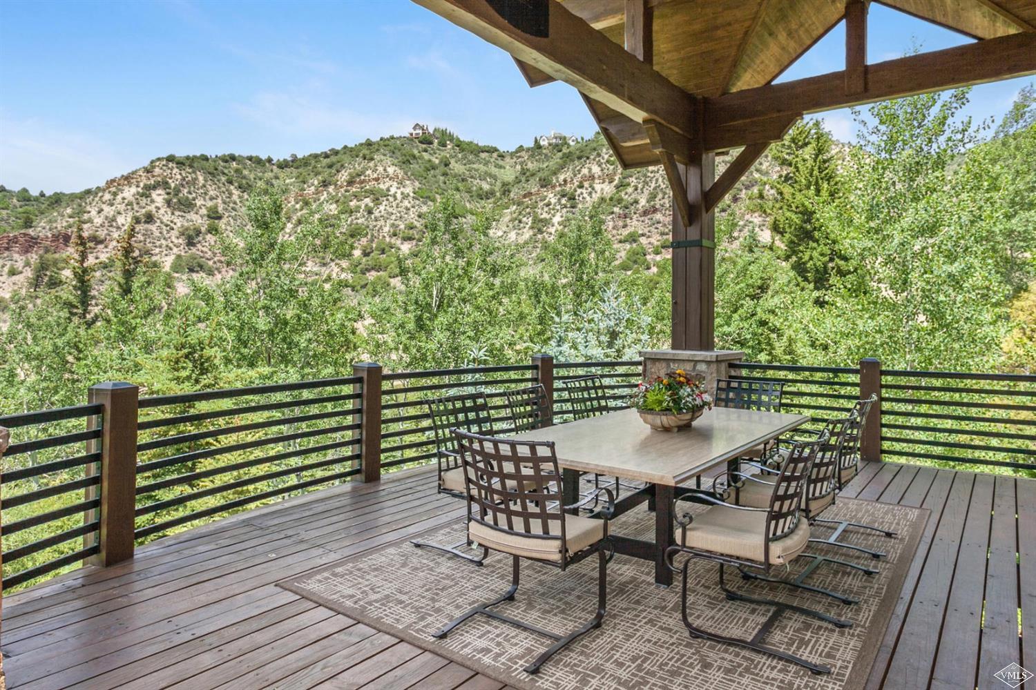 605 Andorra Road Edwards, CO 81632 - Photo 20 of 25 a view of a chairs and table on the deck