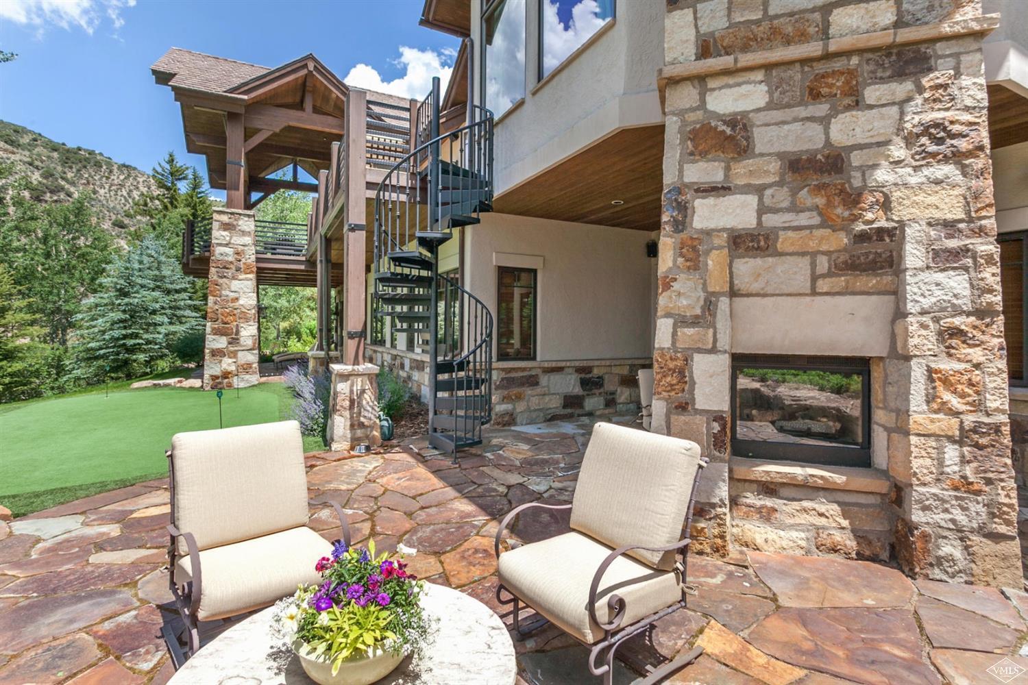 605 Andorra Road Edwards, CO 81632 - Photo 21 of 25 a view of a patio with a table and chairs