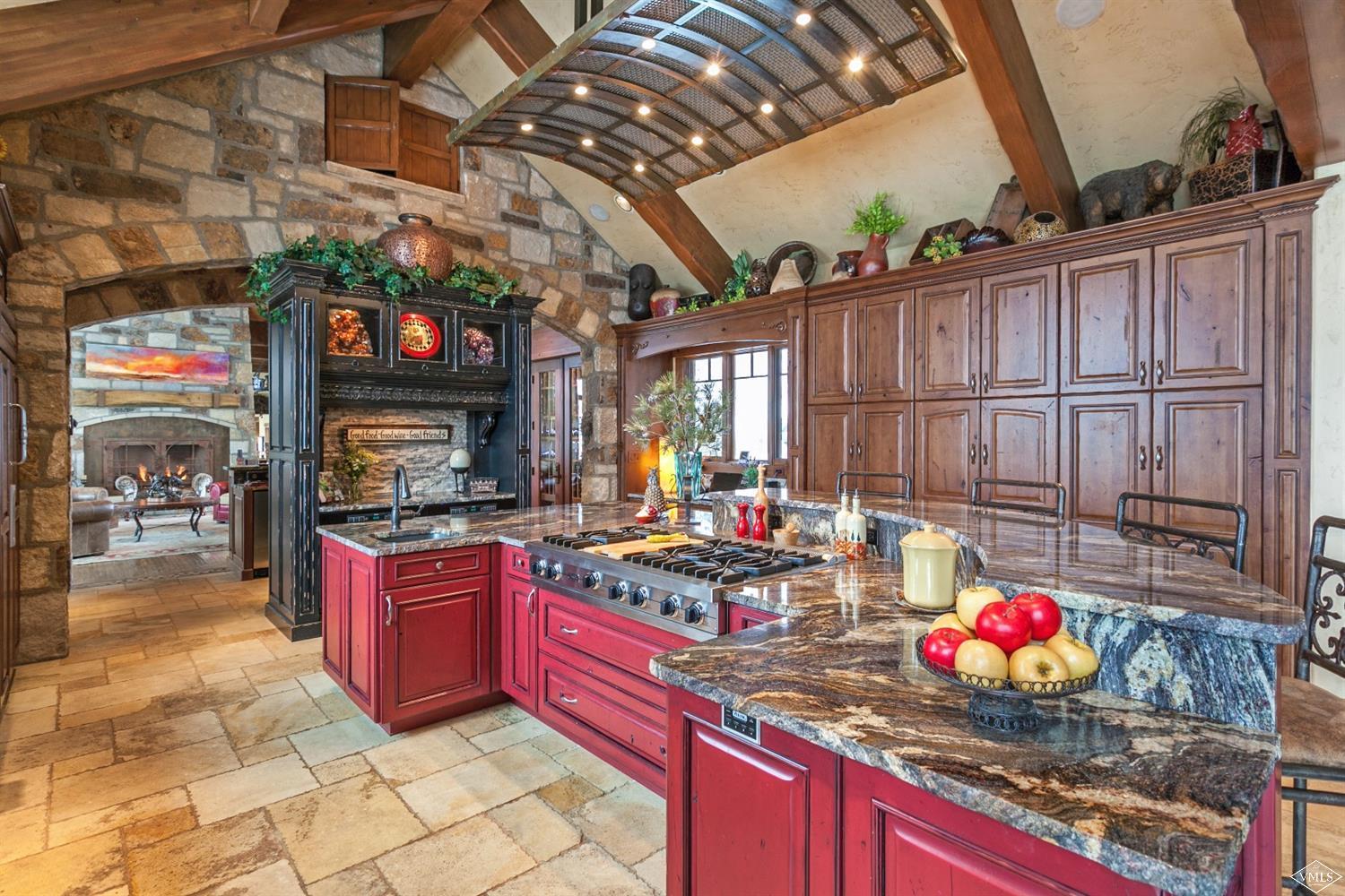 605 Andorra Road Edwards, CO 81632 - Photo 8 of 25 a kitchen with stainless steel appliances granite countertop a stove a sink and a microwave