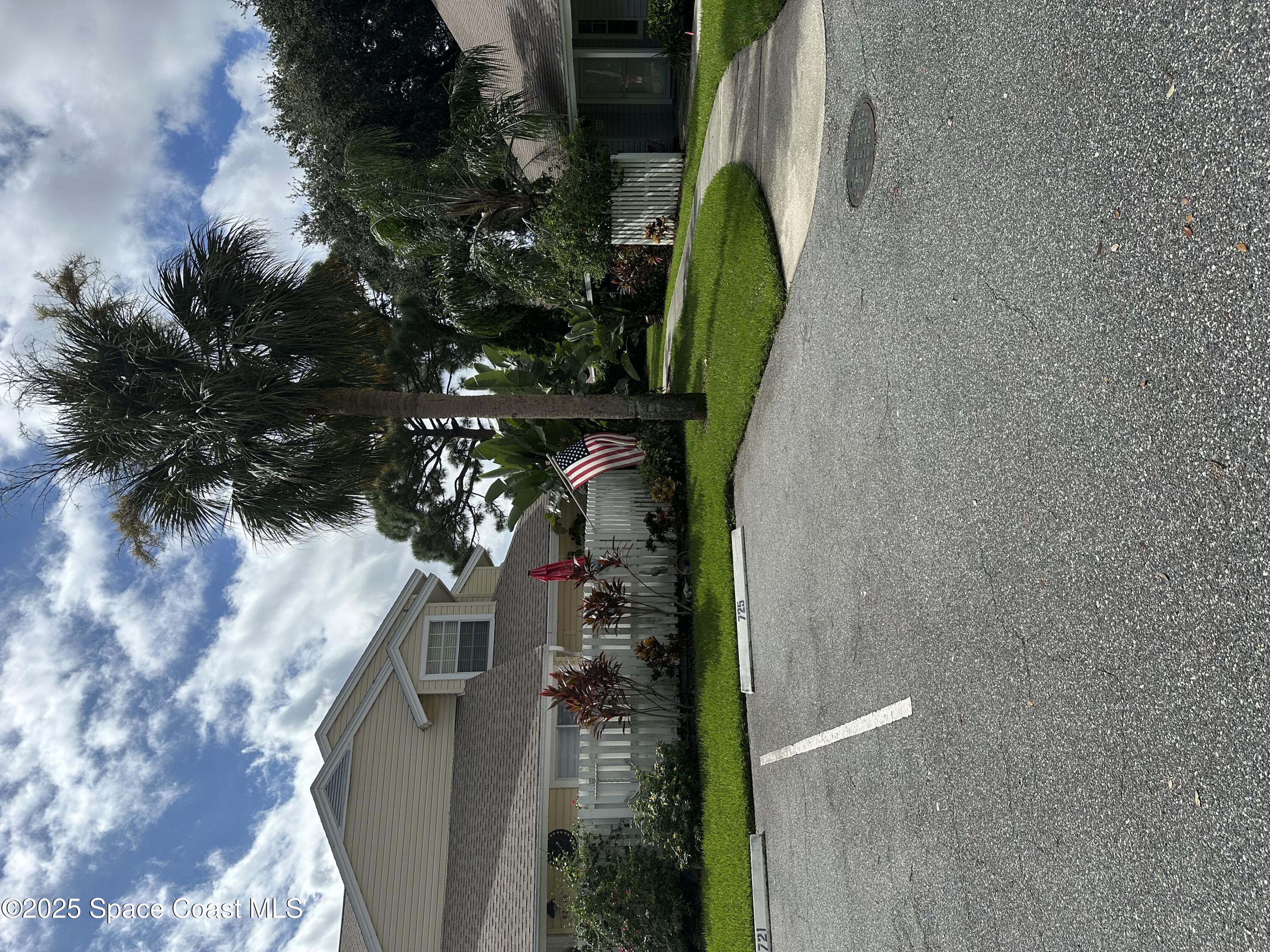 723 Players Court Melbourne, FL 32940 - Photo 1 of 15 a view of a house with a yard and garage