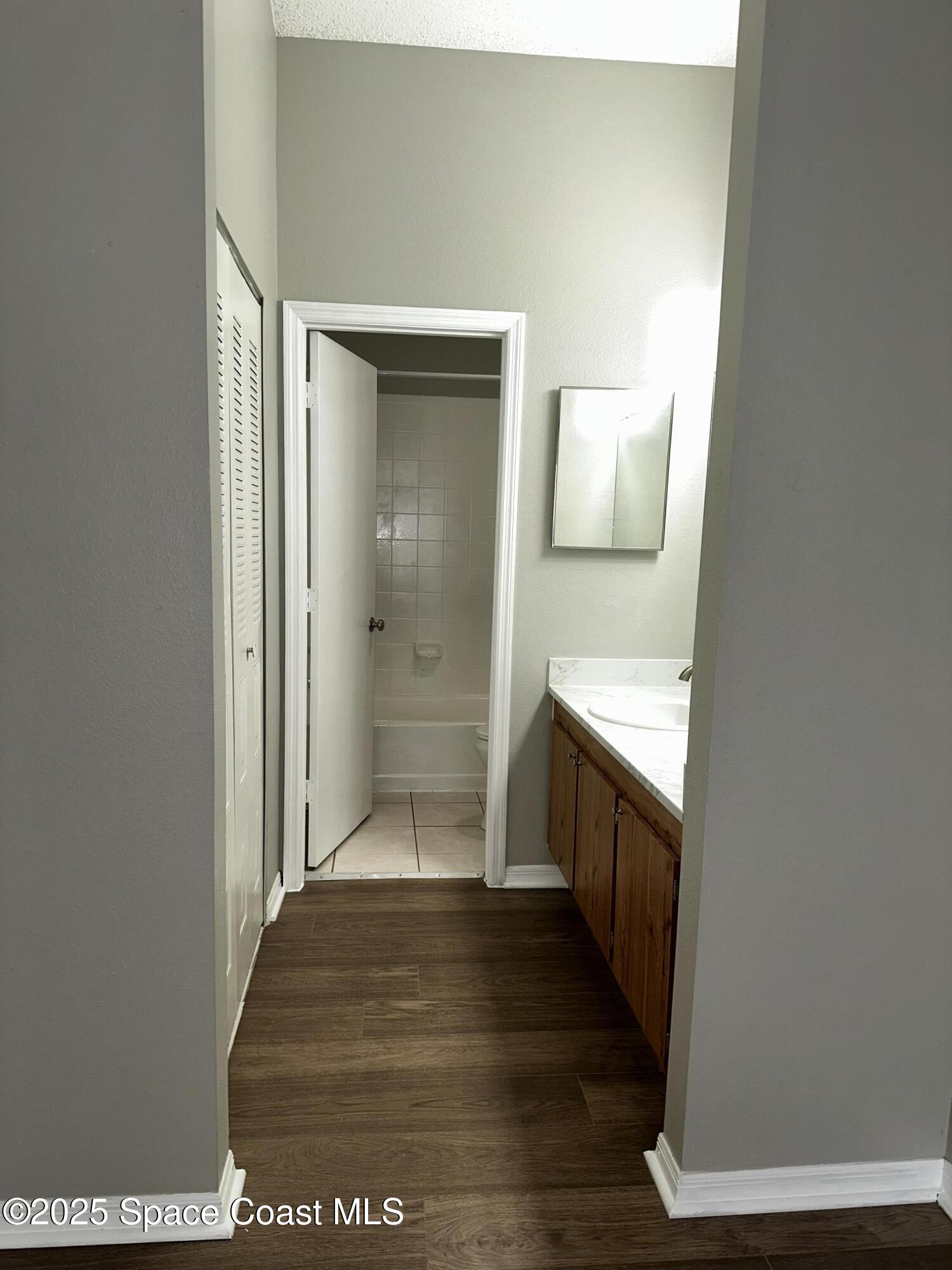 723 Players Court Melbourne, FL 32940 - Photo 12 of 15 a bathroom with a sink and a mirror