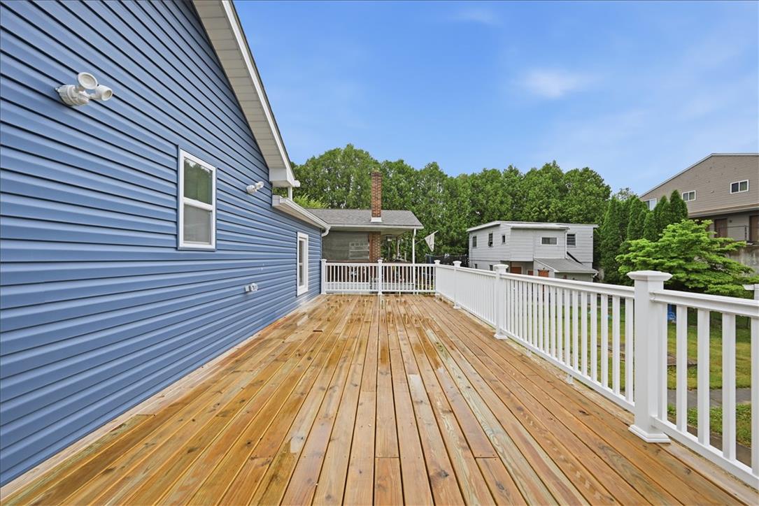 5641 North Coplay Road Whitehall, PA 18052 - Photo 49 of 68 A spacious wooden deck provides ample outdoor living space, perfect for entertaining.