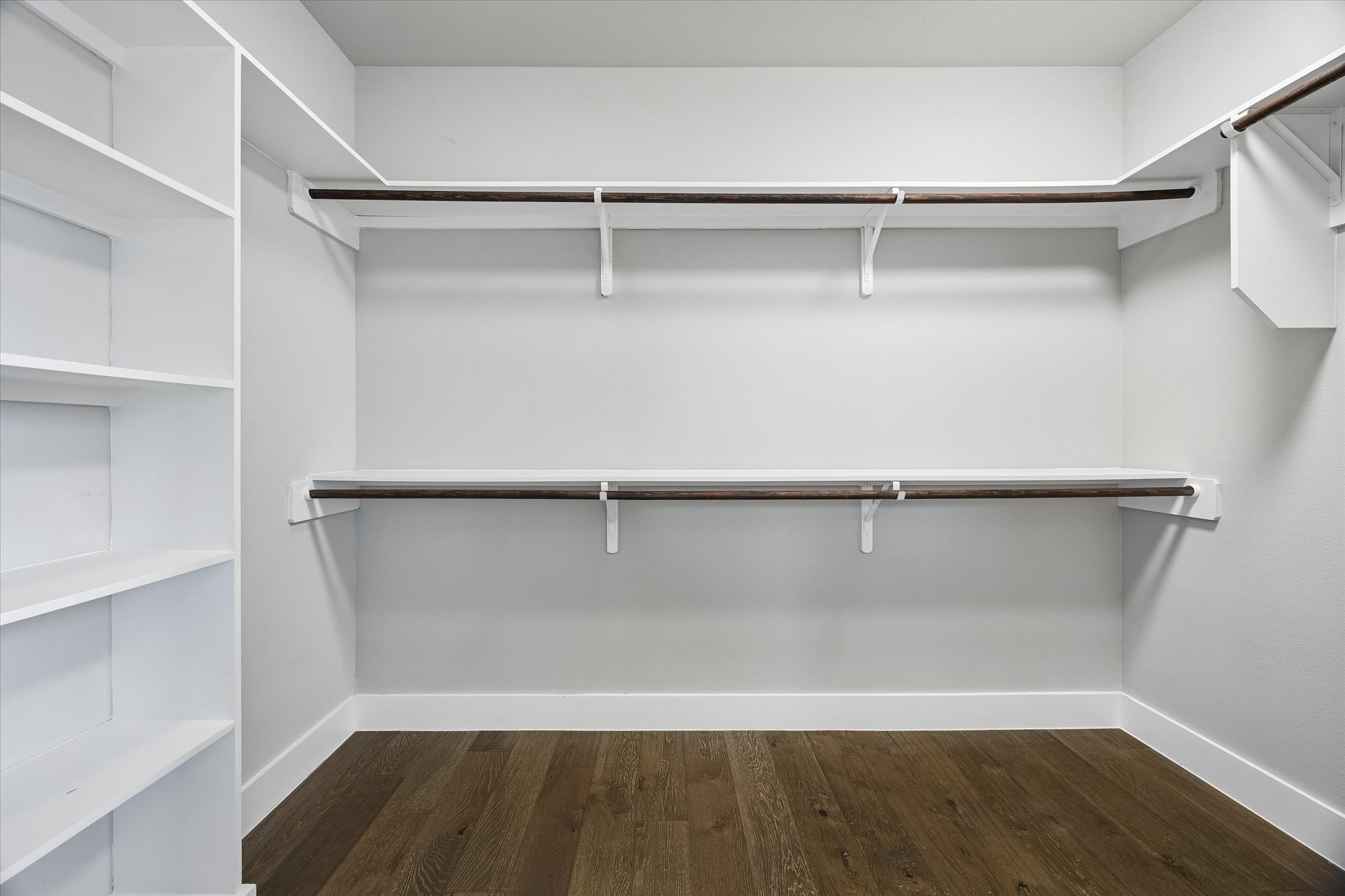 5006 Pecan Springs Road, Unit 6 Austin, TX 78723 - Photo 20 of 30 Ample shelving and hanging space defines this well-organized walk-in closet.