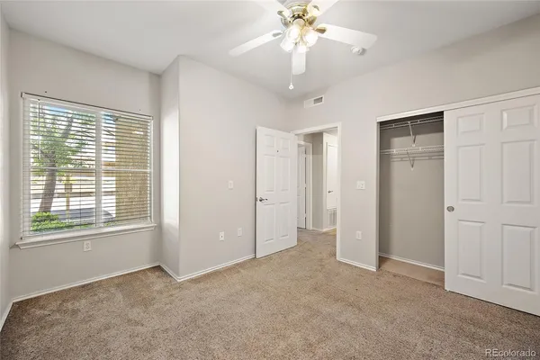 a view of a living room with stainless steel appliances wooden floor and a living room view